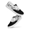 A pair of women's Orca Snork "Goofy Pup" canvas sneakers in a side-view product shot. The shoes feature a black and white design with a pattern of goofy dog faces and hearts.