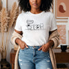 Front view of a female model wearing the Orca Snork "Kiss My Butt" Funny Dog Women's Graphic T-Shirt in white.