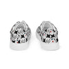 Back view of a pair of Orca Snork Playful One-Eyed Cat Canvas Sneakers, showcasing the vibrant pattern of our one-eyed feline, Orca, along with paw prints, hearts, fishbones, and blue fish.