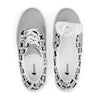 Top-down view of Orca Snork Playful One-Eyed Cat Canvas Sneakers, with one shoe revealing the size tag on the inside of the tongue.