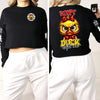 A female model wearing the black "Quackers McSass" cropped sweatshirt, showing the front view with the small Trail Boss duck graphic and the back view with the large "DON'T DUCK with me" graphic.